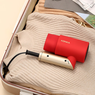 Le séchoir à cheveux pliable et portable de l'agence de voyage avec protection contre le vent chaud