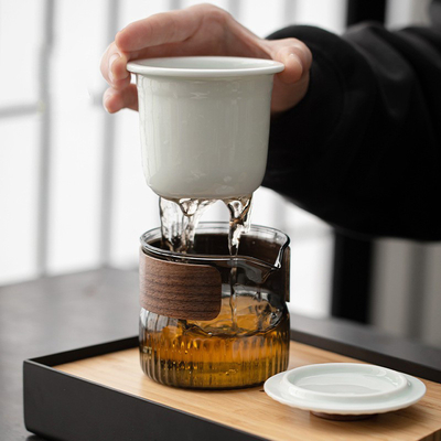 Ensemble cadeau de présentation Dongli Voyage Express Ensemble de tasse Portable Sac rond Un pot Trois tasses Ensemble de thé d'affaires cadeau