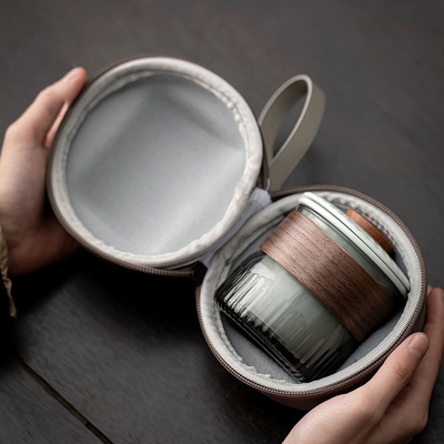 Ensemble cadeau de présentation Dongli Voyage Express Ensemble de tasse Portable Sac rond Un pot Trois tasses Ensemble de thé d'affaires cadeau