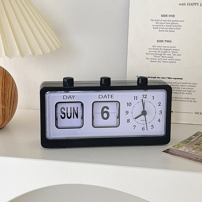 Horloge de réveil de bureau à bouton manuel avec calendrier créatif