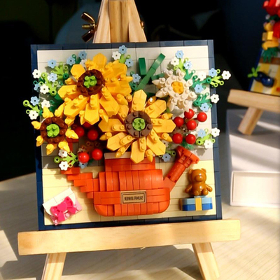 Des roses de Noël des tournesols et des lis des petits grains des blocs de construction pour l'impression 3D